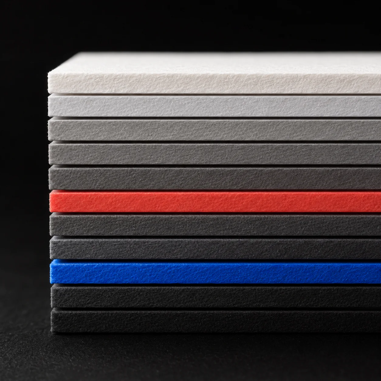 A selection of uncoated packaging boards in ivory and cobalt