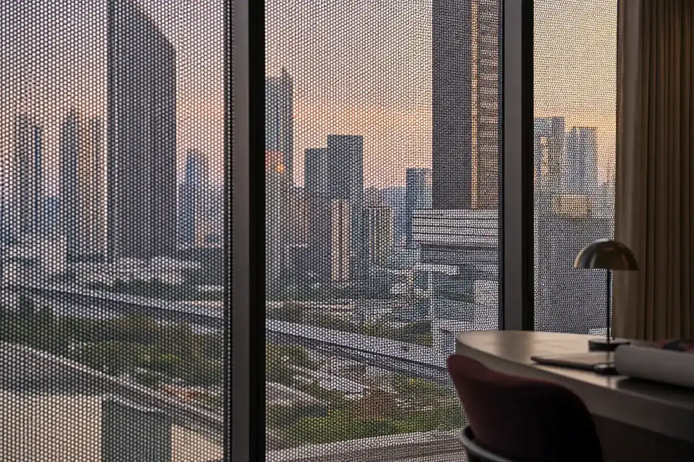 Close view of architectural window film aligned across large glass panes